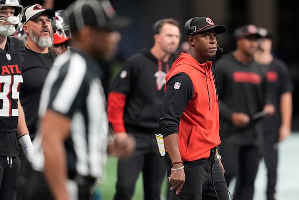 Atlanta Falcons head coach Raheem Morris watches from the sidelines during the first half of an NFL football game against the Los Angeles Chargers on Sunday, Dec. 1, 2024 in Atlanta. (AP Photo/Mike Stewart)