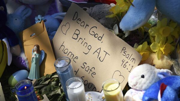 A makeshift memorial grows Monday, April 22, 2019, outside the home of 5-year-old Andrew “A.J.” Freund in Crystal Lake, Ill. Crystal Lake police say K-9s have not found the scent of the boy, who was reported missing the morning of April 18 by his parents, anywhere other than inside the house, which they say indicates Andrew didn't leave on foot. Searchers from a total of 15 agencies have spent the past five days looking for the boy.