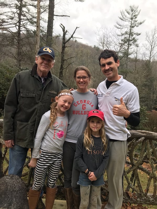 The Topple family. Jim Topple (left with Georgia Tech hat) is a Tech grad, as are Trasie (center, in Georgia T-shirt) and Craig (white polo). Daughters Ruby (headband) and Zia (baseball cap). Jim Topple is Craig's father. (Courtesy of Trasie Topple)