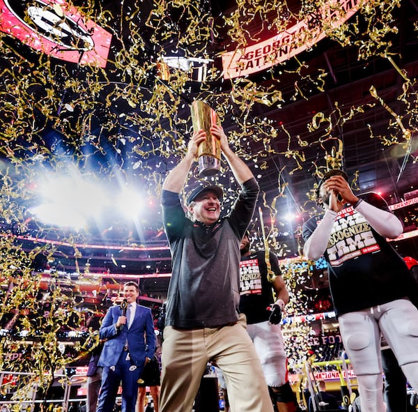 Georgia head coach Kirby Smart lifts the National Championship Trophy after their win against TCU in the 2023 College Football Playoff National Championship at SoFi Stadium, Monday, Jan. 9, 2023, in Inglewood, Ca. Georgia won 59-7. (Jason Getz / Jason.Getz@ajc.com)