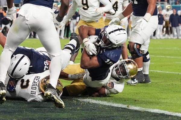 Penn State running back Nicholas Singleton (10) scores a touchdown during the second half of the Orange Bowl College Football Playoff semifinal game against Notre Dame, Thursday, Jan. 9, 2025, in Miami Gardens, Fla. (AP Photo/Lynne Sladky)