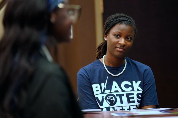 Bennett College student Zairen Jackson listens to a fellow student answer a question during a roundtable in Greensboro, N.C., Tuesday, Oct. 8, 2024. (AP Photo/Chuck Burton)