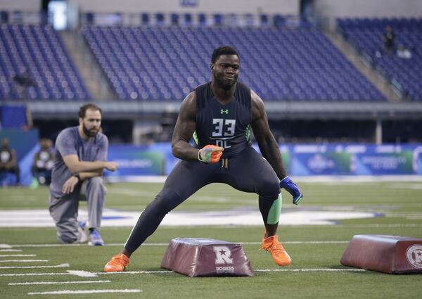 Clemson defensive lineman Shaq Lawson runs a drill at the NFL football scouting combine on Tuesday, March 1, 2016, in Indianapolis. (AP Photo/Darron Cummings)