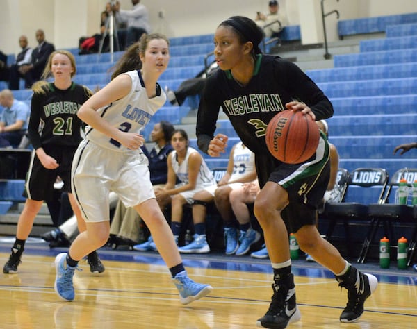 January 8, 2016 Atlanta - Wesleyan Mikayla Coombs (3) dribbles past Lovett Ellie McCollam (24) at Lovett High School on Friday, January 8, 2016. Wesleyan won 74 - 32 over the Lovett. HYOSUB SHIN / HSHIN@AJC.COM