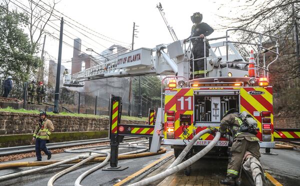 Firefighters respond to the blaze Thursday morning at the former Morris Brown College dormitory.