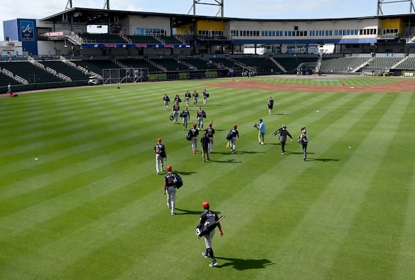 Atlanta Braves players during their first full-squad spring training workouts Tuesday.