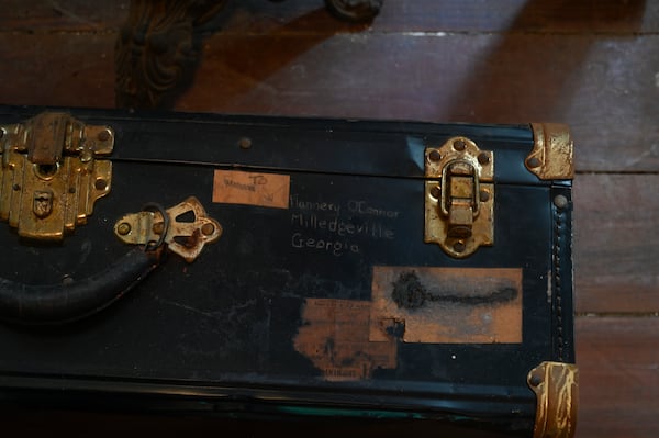 A suitcase with Flannery O'Conner's handwriting was found inside the Cline House where O'Connor lived while she was in high school. The suitcase and other personal belongings will be shown during an exhibition, "Flannery at 100 -- Hidden Treasures," at the Andalusia Interpretive Center on March 25.