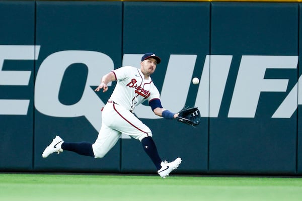 Atlanta Braves outfielder Adam Duvall makes a catch from Red Sox outfielder Tyler O'Neill  during the seventh inning at Truist Park on Tuesday, May 7, 2024. (Miguel Martinez/ AJC)