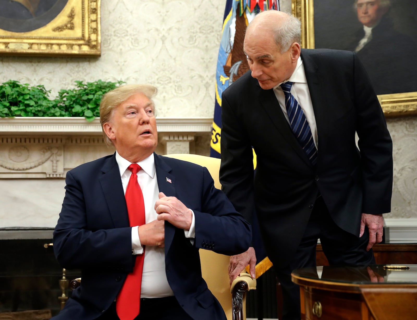 FILE - White House Chief of Staff John Kelly, right, leans in to talk with President Donald Trump in the Oval Office of the White House in Washington, June 27, 2018. (AP Photo/Pablo Martinez Monsivais, File)