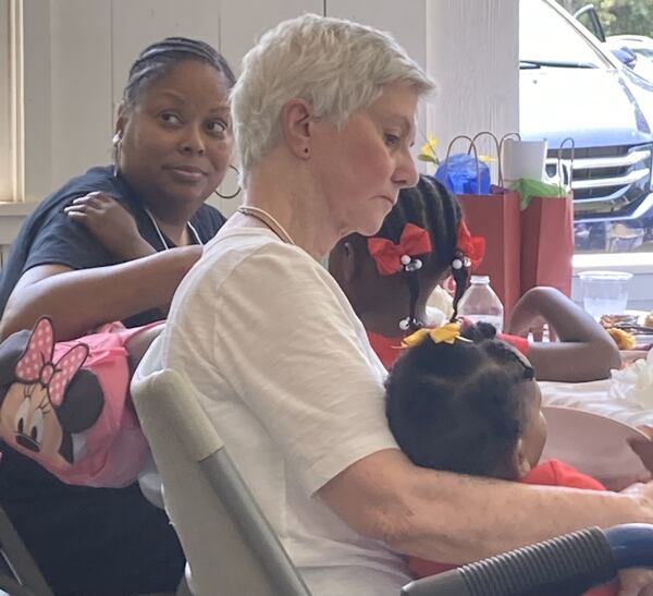 Cynthia Jenkins (left) and Carolyn Stephens (right) sit next to each other during an introductory lunch at the Stephens family reunion. Alexander H. Stephens was the vice president of the Confederacy, a Georgia governor, and a slave owner. Over the Juneteenth weekend of June 17-18, 2023, Stephens' heirs - Black and white - gathered at Liberty Hall, his estate-turned-state park in Crawfordville, Ga., to address their shared history.