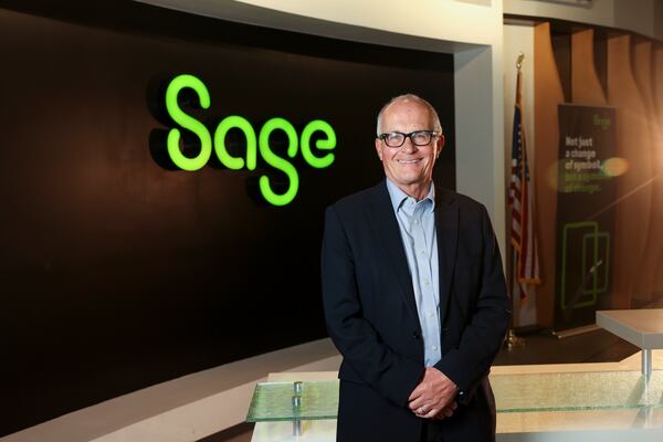 Sage CEO Steve Hare poses for a portrait in the lobby at Sage’s North America headquarters, Tuesday, April 23, 2024, in Lawrenceville, Ga. Sage, a publicly traded accounting, financial, HR, and payroll technology company whose North America headquarters is  in metro Atlanta, announced an expansion of its partnership with Morehouse College. (Jason Getz / AJC)
