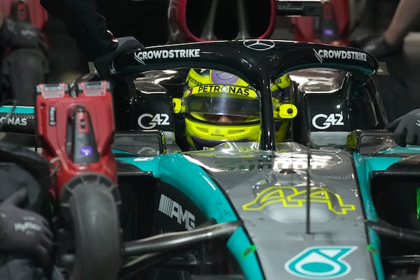 Mercedes driver Lewis Hamilton, of Britain, sits in is carvduring qualifications for the Formula One U.S. Grand Prix auto race, Friday, Nov. 22, 2024, in Las Vegas. (AP Photo/John Locher)