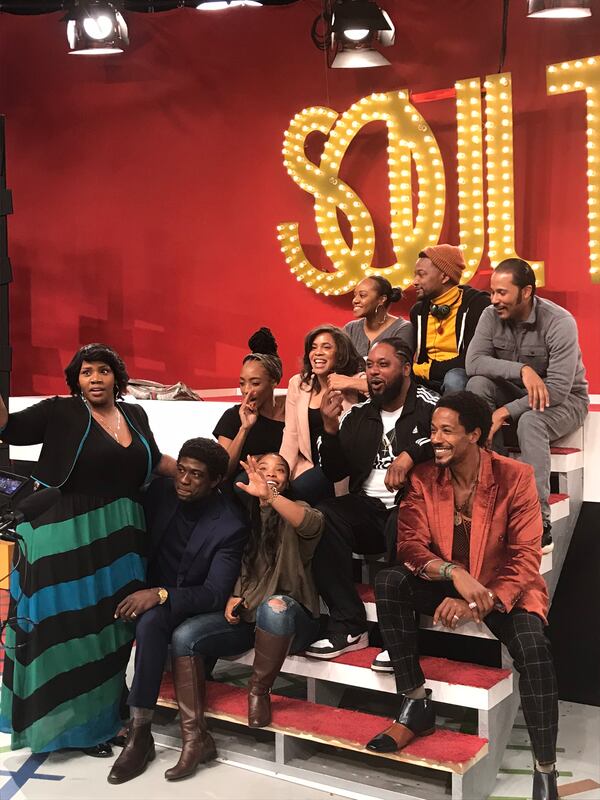 The cast of 'American Soul" takes a shot in front of the "Soul Train" sign December 19, 2018. CREDIT: Rodney Ho/rho@ajc.com