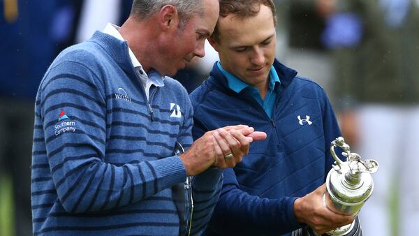 Winner Jordan Spieth and runner up Matt Kuchar (left) look at the trophy after the final round of the British Open Golf Championship, at Royal Birkdale, Southport, England, Sunday July 23, 2017.