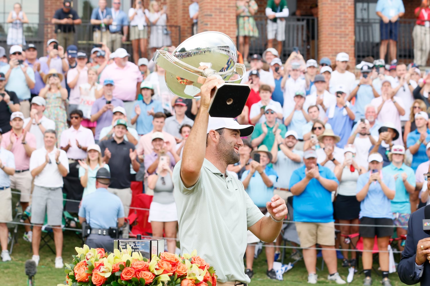 Scottie Scheffle celebrates with the FedEx Cup trophy after winning the Tour Championship at East Lake Golf Club Sunday, Sept. 1, 2023, in Atlanta. 
(Miguel Martinez / AJC)