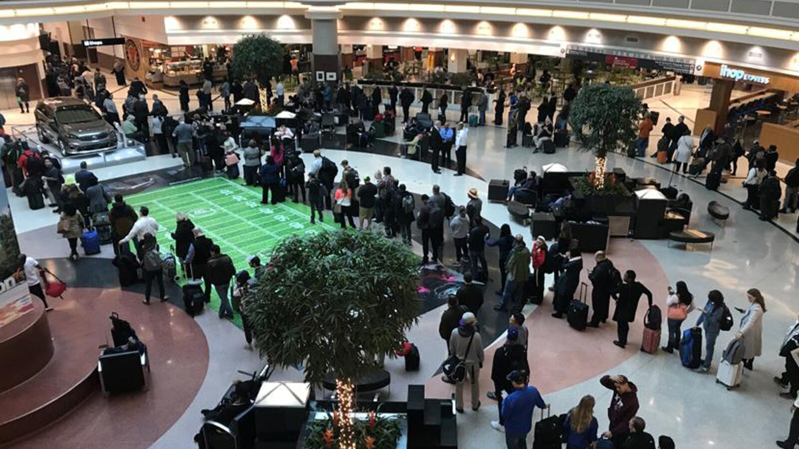 Travelers wait in line for TSA checkpoints at Atlanta's Hartsfield-Jackson International Airport.