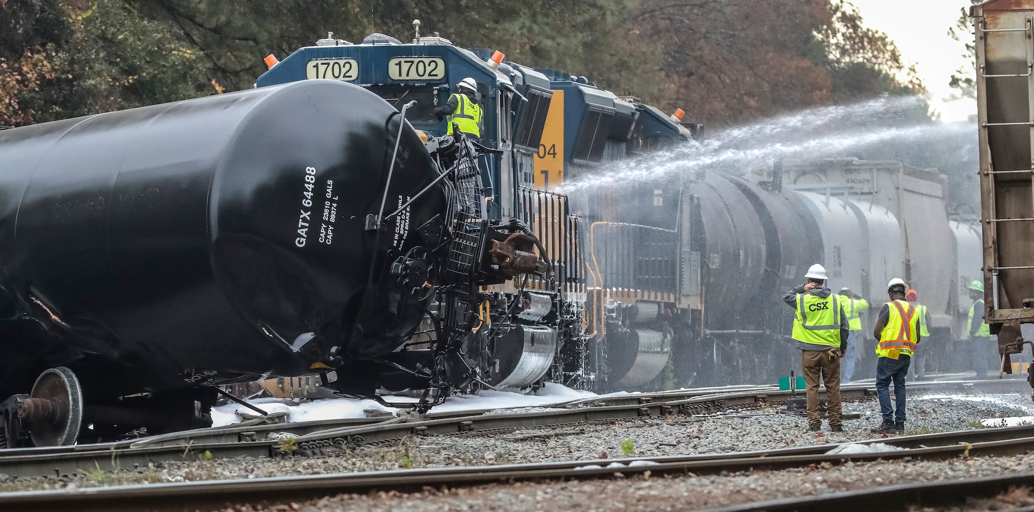 Eight train cars derailed and the locomotive caught on fire in a northwest Atlanta railyard early Friday morning, Nov. 17, 2023. According to CSX officials, a Norfolk Southern train came into contact with a CSX train just before 6:30 a.m. at an interchange point in the Howells Yard near Chattahoochee Avenue and Howell Mill Road. (John Spink / John.Spink@ajc.com)

