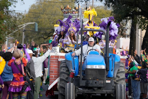 Revelers look on during the Zulu parade on Mardi Gras Day, Tuesday, March 4, 2025 in New Orleans. (AP Photo/Gerald Herbert)