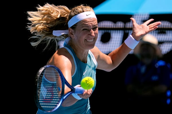 FILE - Victoria Azarenka of Belarus plays a forehand return to Lucia Bronzetti of Italy during their first round match at the Australian Open tennis championship in Melbourne, Australia, Jan. 13, 2025. (AP Photo/Vincent Thian, File)