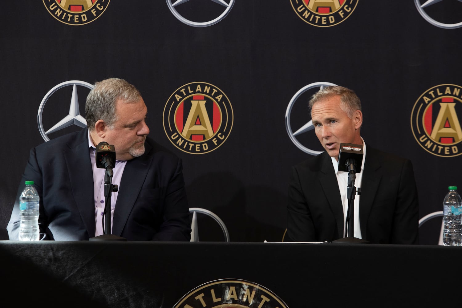 Chris Henderson (right), the newly appointed chief soccer officer and sporting director of Atlanta United, and Garth Lagerwey (left), president and chief executive officer of Atlanta United, speak during a press conference introducing Henderson as the new technical director on Tuesday, December 17, 2024, at the Atlanta United training grounds in Marietta, Georgia. CHRISTINA MATACOTTA FOR THE ATLANTA-JOURNAL CONSTITUTION.


