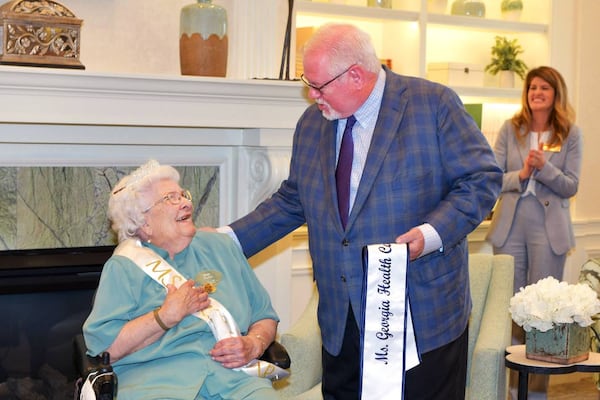 Tony Marshall, President and Chief Executive Officer at Georgia Health Care Association surprises Joy Graham with the news that she is this year’s Ms. Georgia Health Care Association. (Courtesy of Darrell Roaden/Ledger-Enquirer)