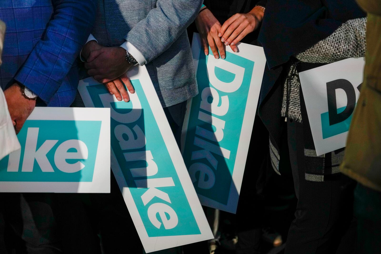 Supporters of the OVP, Austrian People's Party, hold "Thank You" banners at the party headquarters in Vienna, Austria, Sunday, Sept. 29, 2024, after seeing the first electoral projections in the country's national election. (AP Photo/Andreea Alexandru)