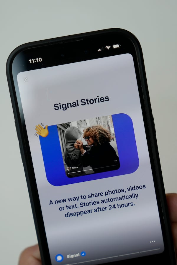 An image from the Signal app is shown on a mobile phone in San Francisco, March 18, 2025. (AP Photo/Jeff Chiu)