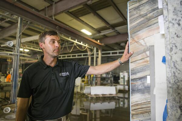 Jacques Steyn, president of Mega Granite & Marble in Newnan, explaining why the company is threatened by Commerce Department duties that make imported quartz much more expensive. (Alyssa Pointer/alyssa.pointer@ajc.com)