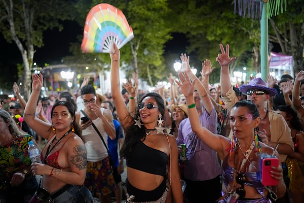 Revelers dance during Carnival in Sao Luiz do Paraitinga, Brazil, Sunday, March 2, 2025. (AP Photo/Andre Penner)