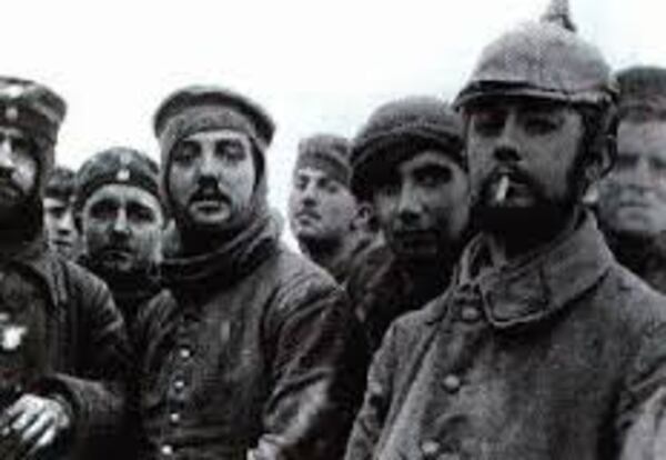 British and Germans pose during the Christmas Truce, 1914. Photo credit: Imperial War Museum