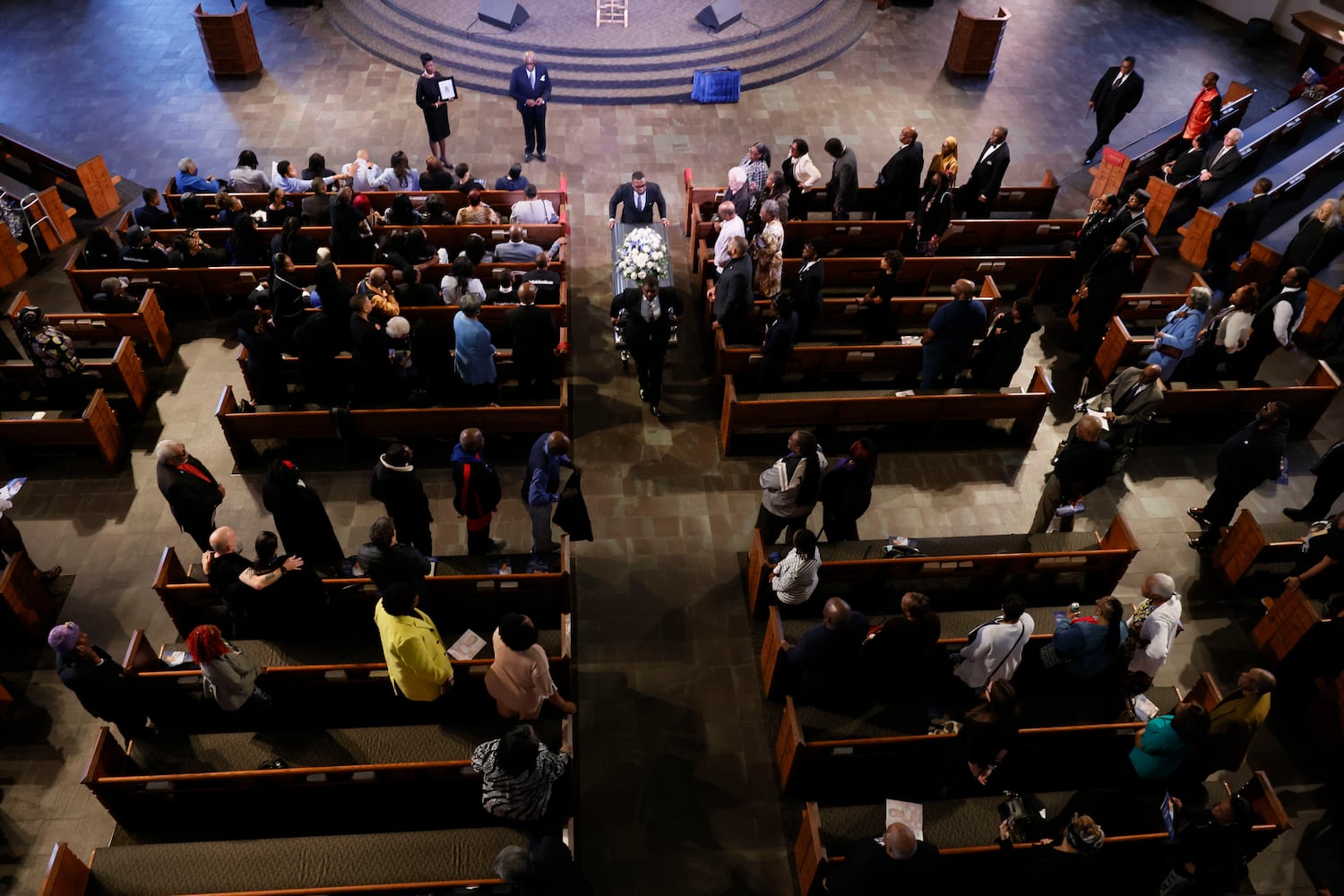 At the end of the funeral service, pallbearers carry the remains of Cornelius Taylor out of Ebenezer Baptist Church. 
(Miguel Martinez/ AJC)