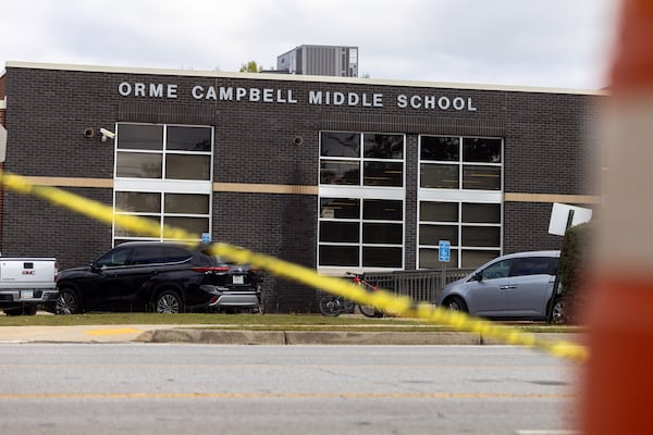 Orme Campbell Middle School is seen through construction caution tape in Smyrna on Friday, November 8, 2024. (Arvin Temkar / AJC)