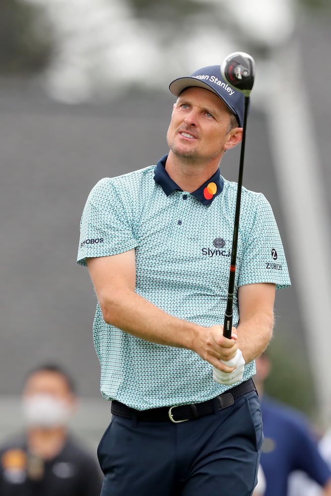 April 9, 2021, Augusta: Justin Rose watches his tee shot on the first hole during the second round of the Masters at Augusta National Golf Club on Friday, April 9, 2021, in Augusta. Curtis Compton/ccompton@ajc.com