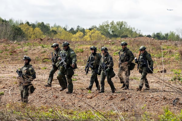 Police sought to clear Intrenchment Creek Park on March 27, 2023, in Atlanta. (Arvin Temkar/The Atlanta Journal-Constitution/TNS)