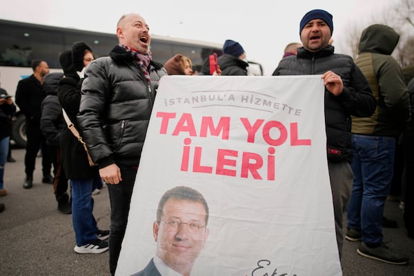 People chant slogans as they protest the arrest of Istanbul Mayor Ekrem Imamoglu in Istanbul, Turkey, Wednesday, March 19, 2025. (AP Photo/Emrah Gurel)