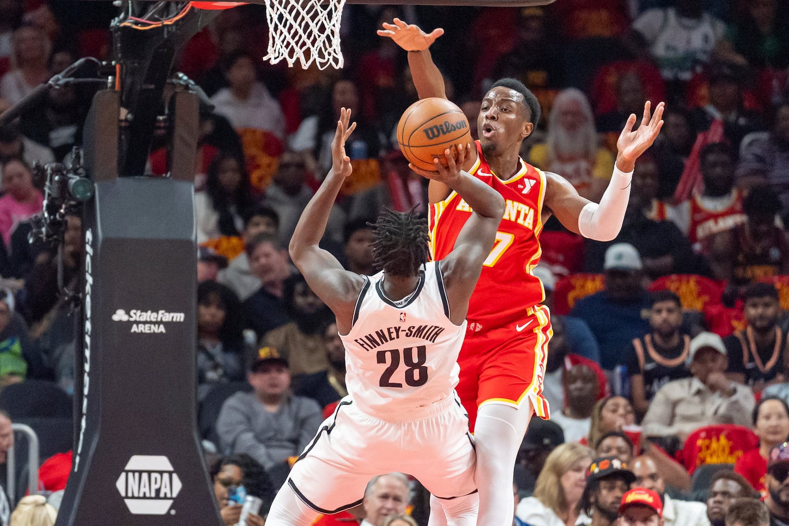 Atlanta Hawks forward Onyeka Okongwu (17) blocks a shot by Brooklyn Nets forward Dorian Finney-Smith (28) during the first half of an NBA basketball game, Wednesday, Oct. 23, 2024, in Atlanta. (AP Photo/Jason Allen)