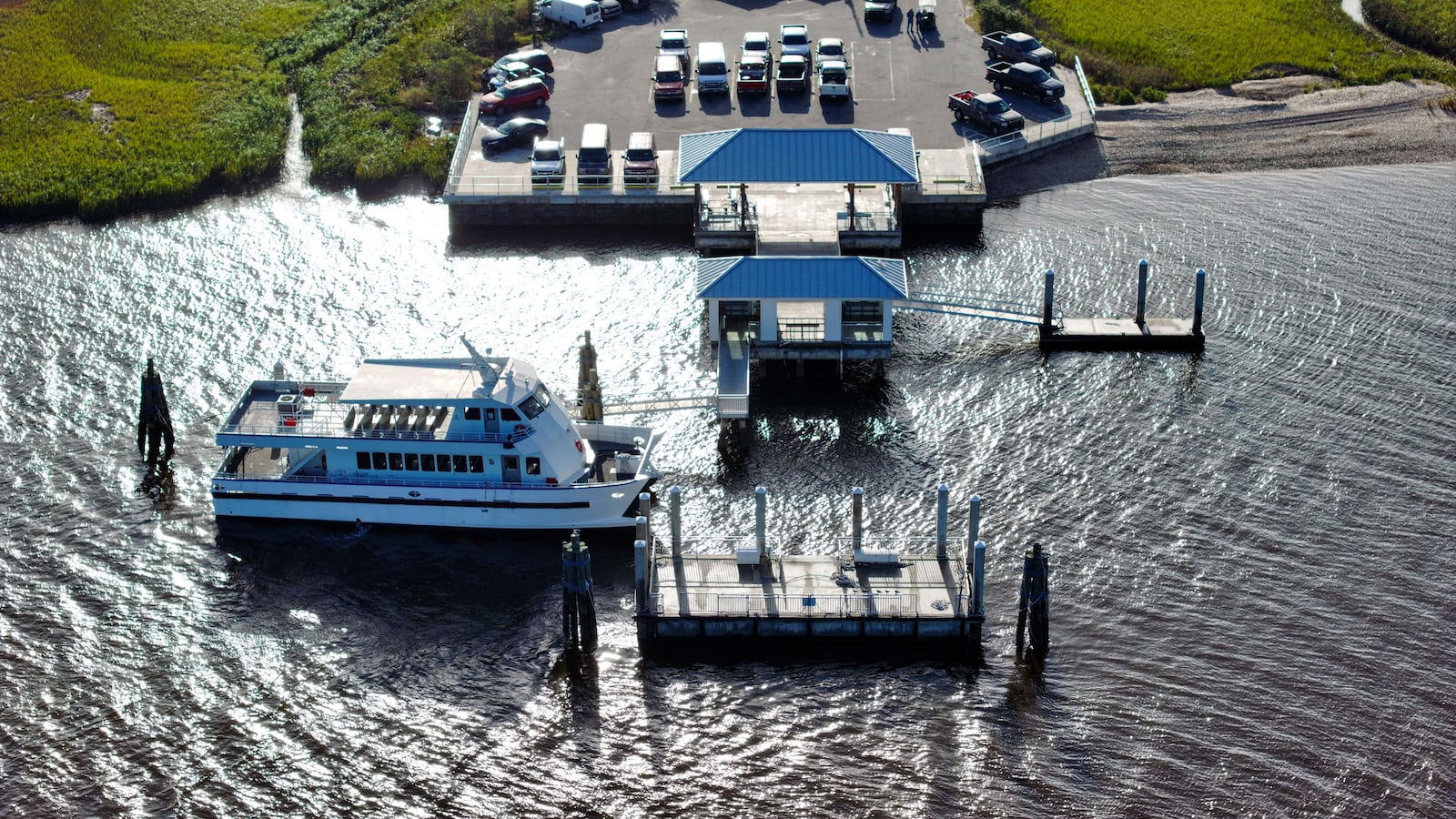 An aerial image of a ferry docked at a pier following a tragedy at Sapelo Island.