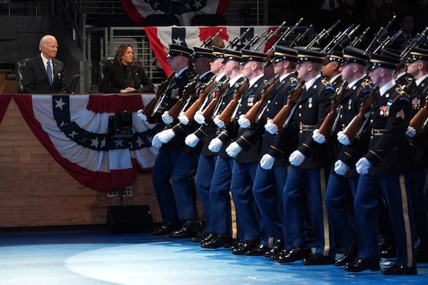 President Joe Biden (left), and Vice President Kamala Harris watch a Department of Defense farewell ceremony for the commander in chief at Joint Base Myer-Henderson Hall in Arlington, Va., on Thursday.