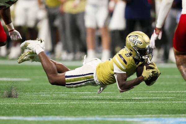 Georgia Tech wide receiver Malik Rutherford (8) makes a 14-yard catch during the fourth quarter against Louisville in the Aflac Kickoff Game at Mercedes-Benz Stadium, Friday, September 1, 2023, in Atlanta. Georgia Tech lost to Louisville 39-34. (Jason Getz / Jason.Getz@ajc.com)