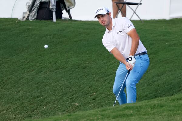 Patrick Cantlay hits toward the eighteenth green during the second round of the Tour Championship at East Lake Golf Club, Friday, August 26, 2022, in Atlanta. (Jason Getz / Jason.Getz@ajc.com)