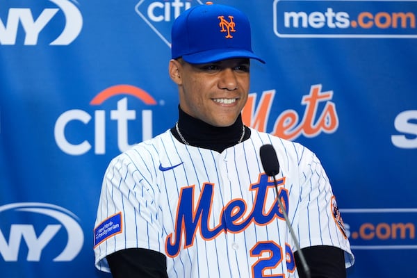 New York Mets' Juan Soto smiles during a baseball news conference, Thursday, Dec. 12, 2024, in New York. (AP Photo/Frank Franklin II)