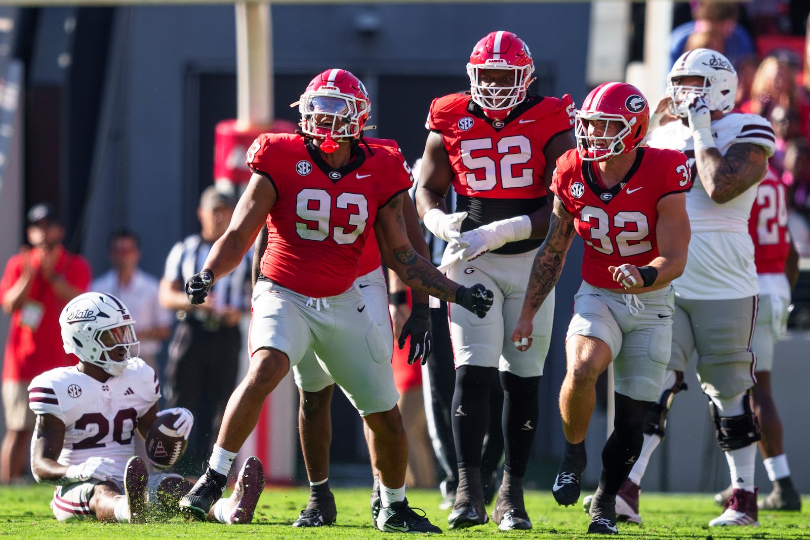 Georgia defensive lineman Tyrion Ingram-Dawkins (93) celebrates after tackling Mississippi State running back Johnnie Daniels (20) during an NCAA college football game, Saturday, Oct. 12, 2024, in Athens, Ga. (AP Photo/Jason Allen)