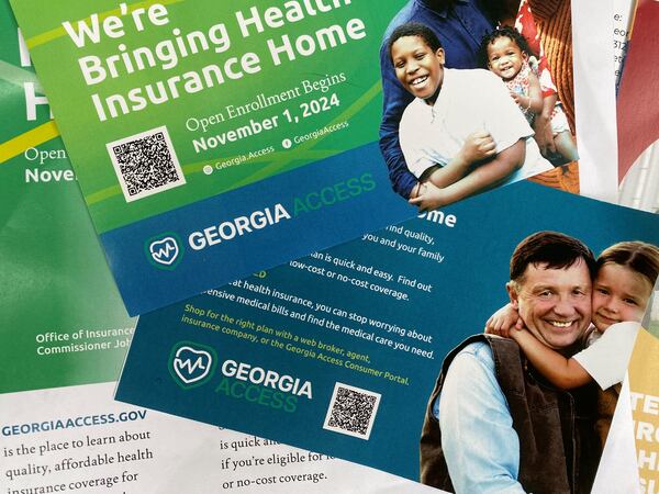 Promotional materials for GeorgiaAccess.gov distributed at a Georgia Access launch event Friday, Nov. 1, 2024 near the Georgia Capitol.  Georgia Access is the new state-based exchange marketplace for the Affordable Care Act in Georgia. (Photo by Ariel Hart)