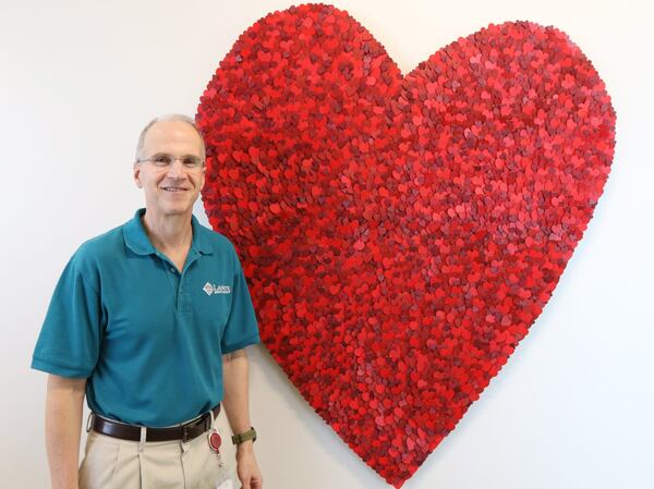 Dr. Scott Shulman hand-painted 3,000 hearts to create a giant heart on display at the Midtown location of Laureate Medical Group. His projects can take anywhere from 50 to 75 hours to complete. He has almost 40 works on display at Laureate Medical Group offices where he practices internal medicine. EMILY HANEY/ EMILY.HANEY@AJC.COM