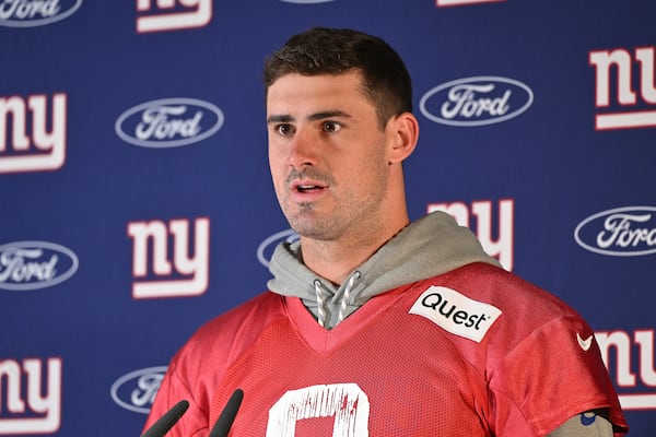 New York Giants quarterback Daniel Jones (8) attends a news conference after a practice session in Munich, Germany, Friday, Nov. 8, 2024. The New York Giants are set to play the Carolina Panthers in an NFL game at the Allianz Arena in Munich on Sunday. (AP Photo/Lennart Preiss)