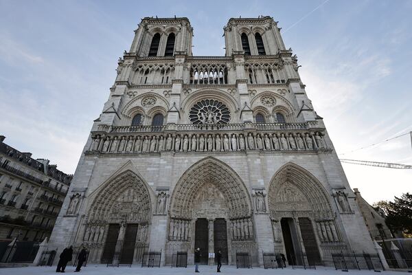 The facade of Notre-Dame Cathedral is seen in Paris, Friday Nov., 29 2024 ahead of French President Emmanuel Macron's final visit to the construction site to see the restored interiors before the iconic monument's reopening for worship on Dec. 8. (Christophe Petit Tesson, Pool via AP)