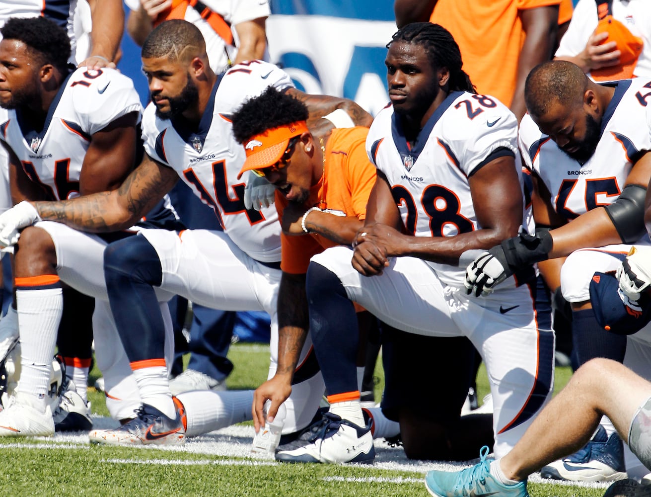 Photos: Falcons show solidarity during National Anthem