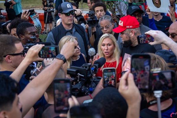 U.S. Rep. Marjorie Taylor Green, R-Rome, speaks to the news media near the Rice Street entrance of the Fulton County Jail in Atlanta on Thursday, August 24, 2023. (Arvin Temkar/arvin.temkar@ajc.com)