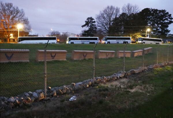  A row of buses sit inside Dobbins Air Reserve Base waiting on as many as 200 passengers from a quarantined Grand Princess cruise ship off the coast of California.Curtis Compton ccompton@ajc.com