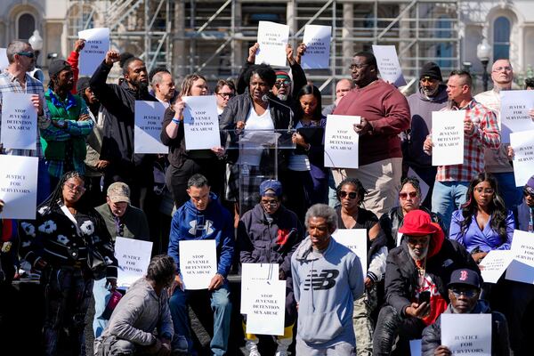 Nalisha Gibbs, center top, speaks during a press conference among other survivors of sexual abuse in Maryland juvenile detention centers, Wednesday, March 19, 2025, in Baltimore. (AP Photo/Stephanie Scarbrough)